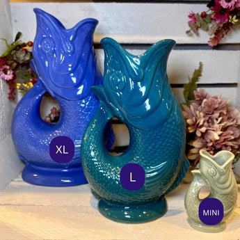 Sea green XL Gluggle Jug by The Gluggle Jug Factory, featuring a classic curved ceramic design with a spout and decorative detailing.