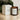 Seaweed and samphire scented votive candle by Plum & Ashby with a clear glass holder and natural botanical design.