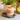 Small shredded cinnamon and orange soy scented candle by Beauty Scents, showing the candle with shredded wax and warm color.