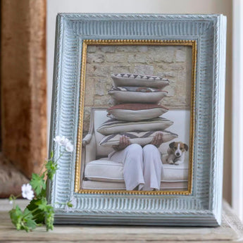 Soft grey wooden 7x5-inch photo frame by Grand Illusions, showcasing a sleek and elegant design for displaying photos.