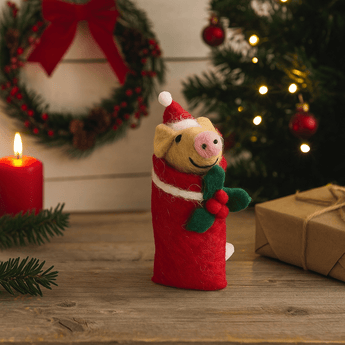 Colorful felt piglet decorations by Amica, arranged in a swaddling style, perfect for nursery or playful decor.