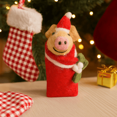 Colorful felt piglet decorations from Amica, featuring adorable swaddling piglet shapes in assorted bright colors.