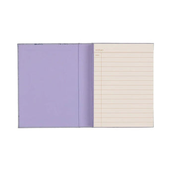 Designworks Collective The Very Tired Woman book-style journal with lined pages and a cover resembling a book.