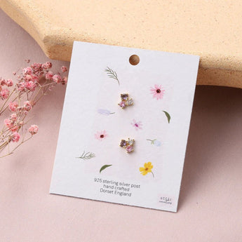 Three color crystal gold earrings by Attic Creations featuring vibrant multi-colored gemstones and elegant gold settings.