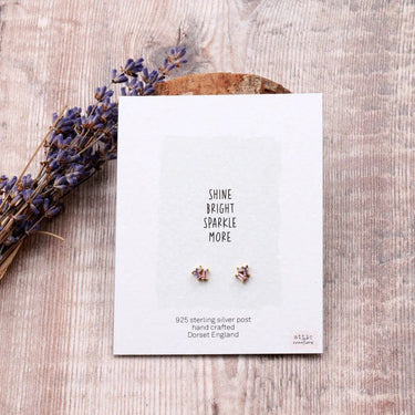 Three Little Gems gold earrings in assorted colors, showcasing small, decorative gemstone designs by Attic Creations.