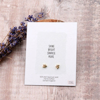 Three Little Gems gold earrings in assorted colors, featuring small, shiny gemstone embellishments from Attic Creations.