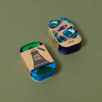 Block Design playing cards featuring a tinned bottle opener engraved with a sleek, modern design.