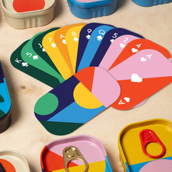 Block Design tinned playing cards set featuring standard playing cards inside a decorative tin container.