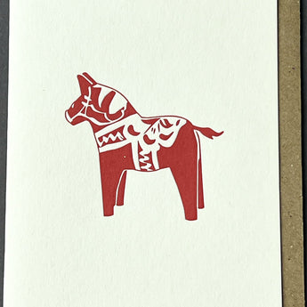 Penguin Ink toy horse greeting card featuring a colorful, playful horse illustration on a greeting card design.