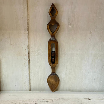 Welsh Love Spoon with two hearts carved from wood by Cadwyn Ltd, showcasing traditional Welsh craftsmanship.