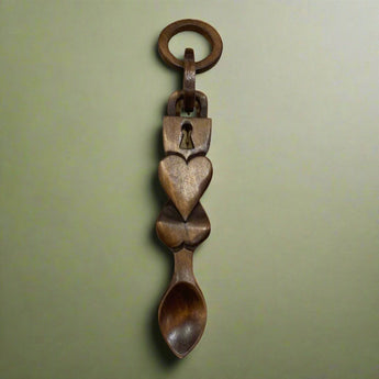 Welsh Love Spoon with intricate carved design, symbolizing love and affection, crafted by Cadwyn Ltd.