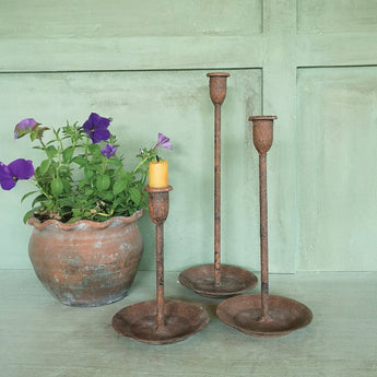 Vintage Rust Medium Candle Holder by Casa Verde, featuring a rustic metal design perfect for decorative candle display.