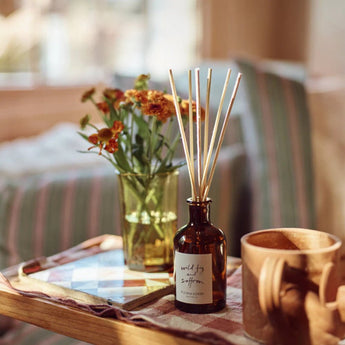 Plum & Ashby Wild Fig & Saffron Reed Diffuser with a glass bottle and reed sticks for elegant home fragrance.