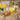 Yellow felt duckling with daisy chain decoration, handmade Amica felt decoration for nursery or craft display.