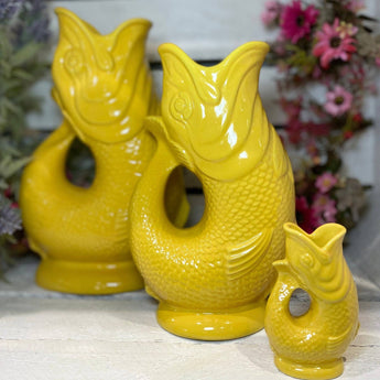Yellow Original Gluggle Jug Mini from The Gluggle Jug Factory with a glossy finish and classic design.