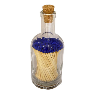 Purple matches in a clear glass bottle from Promo Branding, with striking purple-tipped matchsticks visible inside.