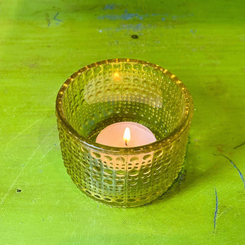 Set of six Grand Illusions Cirque tealight votive candle holders in assorted vibrant colors, perfect for decorative lighting.