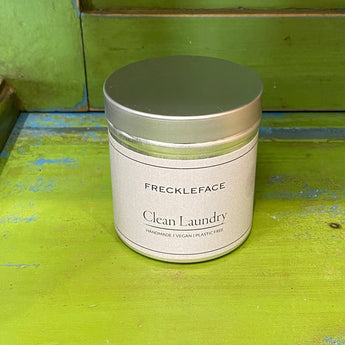 Freckleface clean laundry scented candle in a vintage tin with a cozy, fresh laundry fragrance.