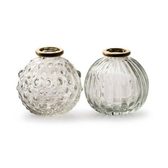 Clear glass vase with vertical pattern, round shape, and gold rim by Casa Verde, ideal for floral arrangements.