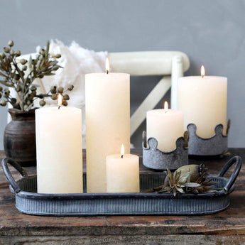 Cream rustic pillar candle from Chic Antique, designed for 16-hour burn time, shown in a natural, textured finish.