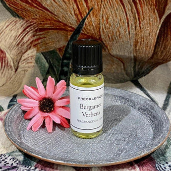 Freckleface Bergamot Verbena fragrance oil bottle with vibrant label, showcasing natural citrus and floral scent ingredients.