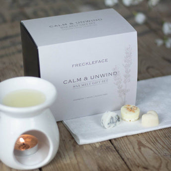 Freckleface Calm + Unwind wax burner gift set featuring a sleek ceramic wax warmer with calming design and accessories.