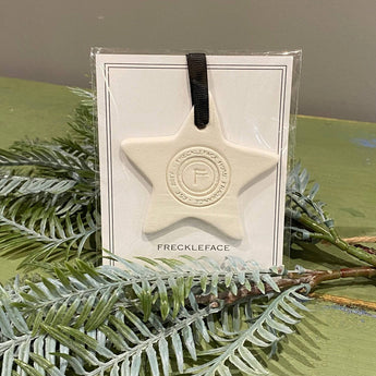 Freckleface Ceramic Star wax burner with a white ceramic finish and star-shaped design for home fragrance use