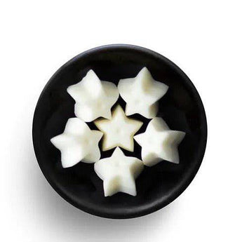 Freckleface Christmas Soya Wax Melts in festive star shape with holiday-themed packaging, ideal for seasonal home fragrance.