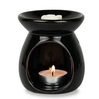 Freckleface Classic Black Wax Burner with a sleek design, ideal for melting wax melts or fragrance oils in a modern home setting.
