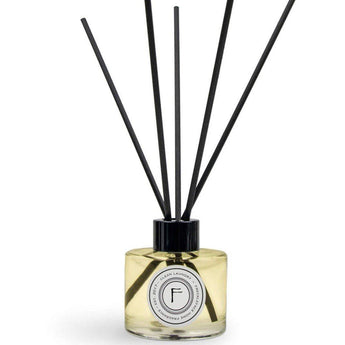 Freckleface Clean Laundry Reed Diffuser with glass bottle and reed sticks, emitting a fresh laundry scent.