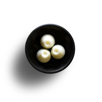 Freckleface Coconut & Sea Salt Soya Wax Melts in a clear container, showcasing the textured wax with a tropical scent.