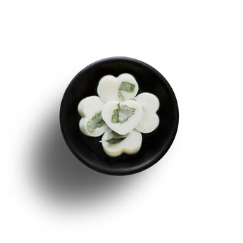 Freckleface eucalyptus and peppermint soy wax melts in a cozy, fragrant cluster for home scenting.