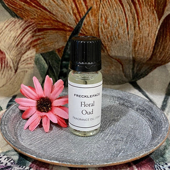 Freckleface Floral Oud Fragrance Oil bottle with floral and oud scent, in a colorful glass container.