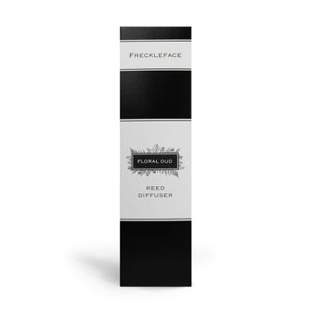 Freckleface Floral Oud Reed Diffuser with elegant glass bottle and reed sticks, showcasing floral and oud fragrance elements.