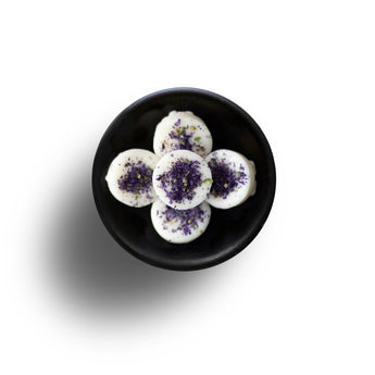 Freckleface Floral Oud Wax Melts in a decorative container with floral design and wax pieces ready for melting.