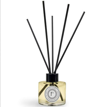Freckleface Lavender Reed Diffuser with ceramic bottle and reed sticks, emitting a soothing lavender scent.