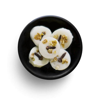 Freckleface Spiced Orange Soya Wax Melts in orange blossom scent, shown in a clear container with textured wax pieces.