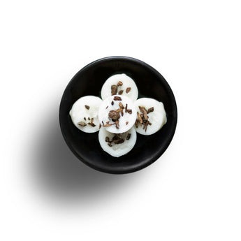 Freckleface Rock Salt and Driftwood wax melts in a natural wax block, showcasing the textured surface and earthy tones.