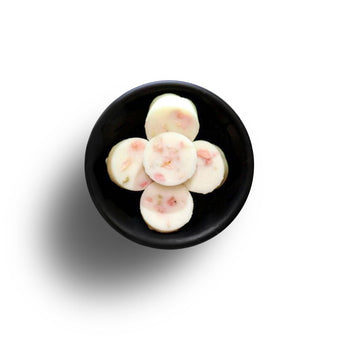 Freckleface Sweet Pea Soya Wax Melts in a clear container with pastel packaging, showcasing fragrant wax melts for home scenting.