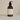 Plum & Ashby Geranium & Orange Hand and Body Wash in a clear bottle with a floral and citrus scent.