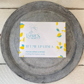 Labre's Hope Lift Me Up Litsea Soap bar with natural ingredients, showcasing the herbal soap with a textured surface and fresh scent.