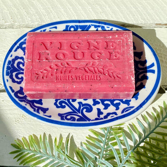 Marseilles Soap Vigne Rouge by Grand Illusions, 125g, featuring a vibrant red and green vine design on a traditional soap bar.
