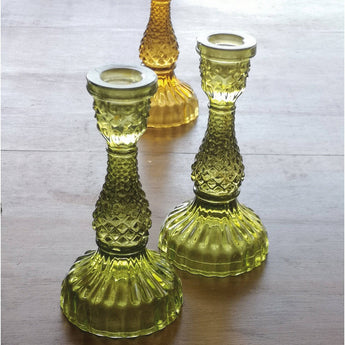 Moss green glass candlestick holder from Casa Verde, cylindrical design perfect for holding a candle.