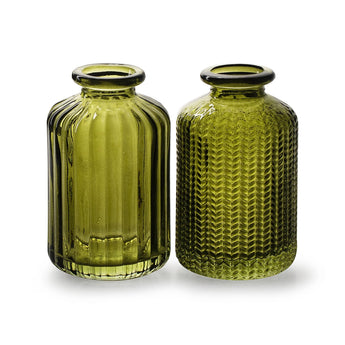 Moss green glass vertical pattern bottle vase with a sleek, narrow neck and textured surface, ideal for modern floral arrangements.