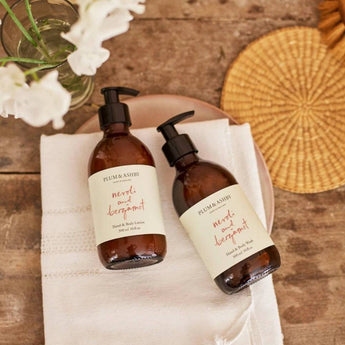 Bottle of Plum & Ashby Neroli & Bergamot Hand and Body Wash with a clear label and elegant packaging.