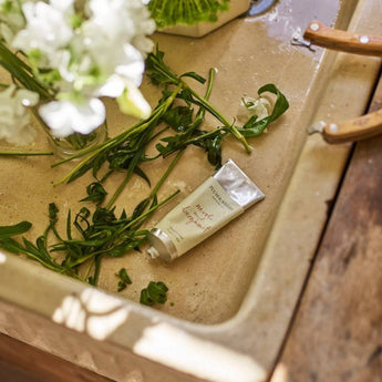 Plum & Ashby Neroli & Bergamot Hand Cream in a sleek tube, showcasing the luxurious packaging and natural ingredients.