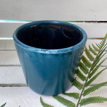 Six old-style Dutch pots in assorted colors by Grand Illusions, featuring traditional design and vibrant finishes.