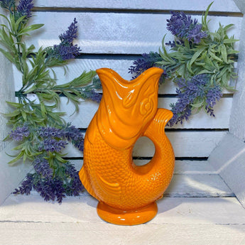 Large orange Gluggle Jug by The Gluggle Jug Factory featuring a classic design and a distinctive spout for pouring.