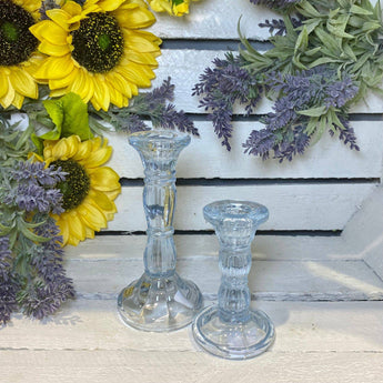 Pastel blue glass candlestick holder, 10cm tall, designed by Gisela Graham, showcasing a smooth, elegant candle holder with a glossy finish.