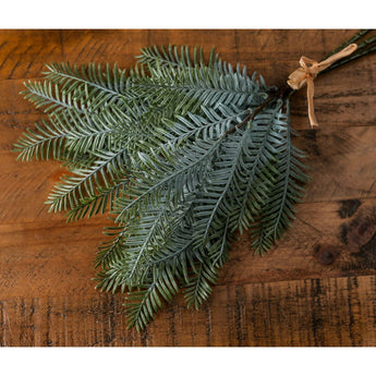 Artificial pine leaf greenery bunch from Hills Interiors, showcasing vibrant green faux flowers and foliage.